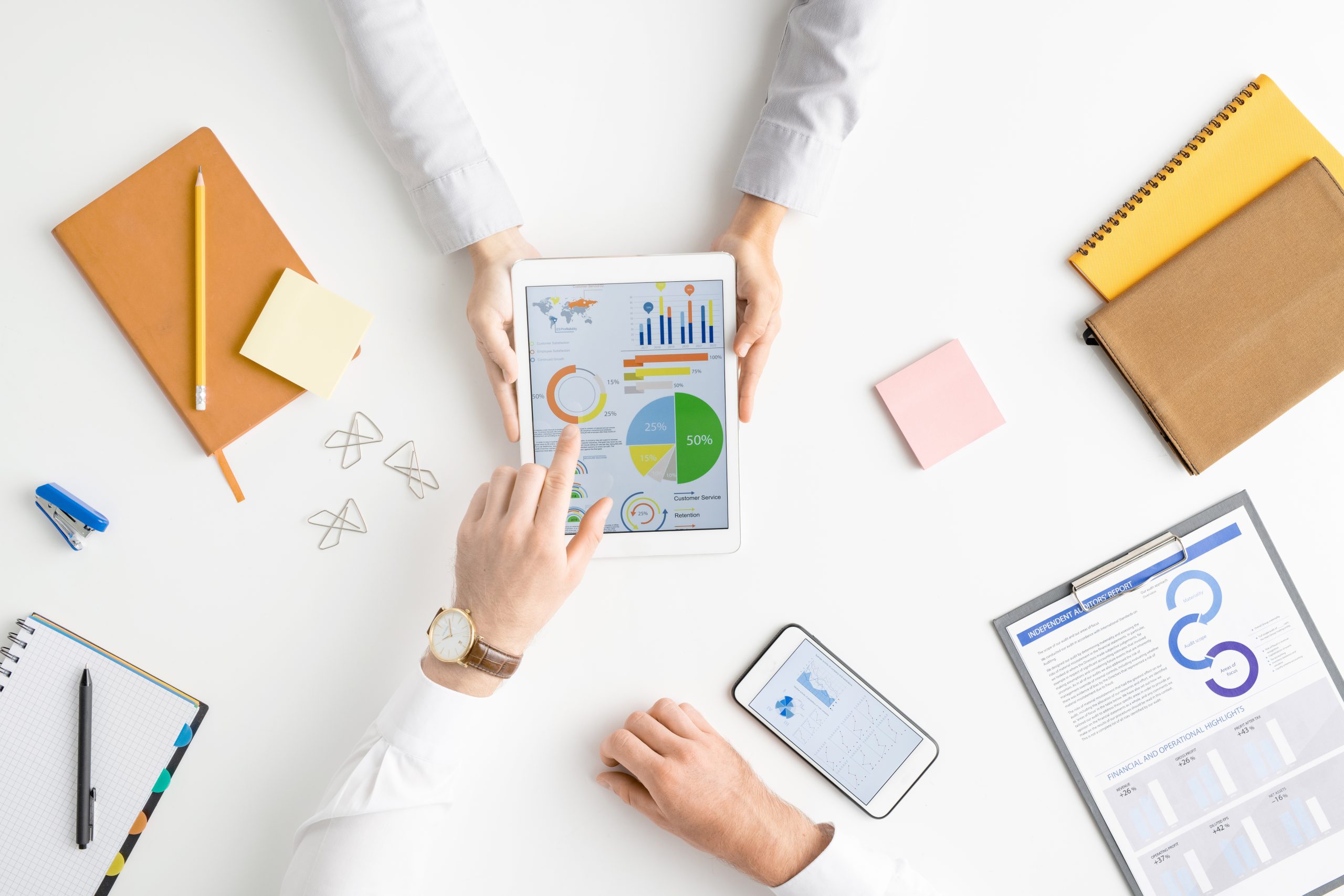 Business analysts reviewing company data and digital performance