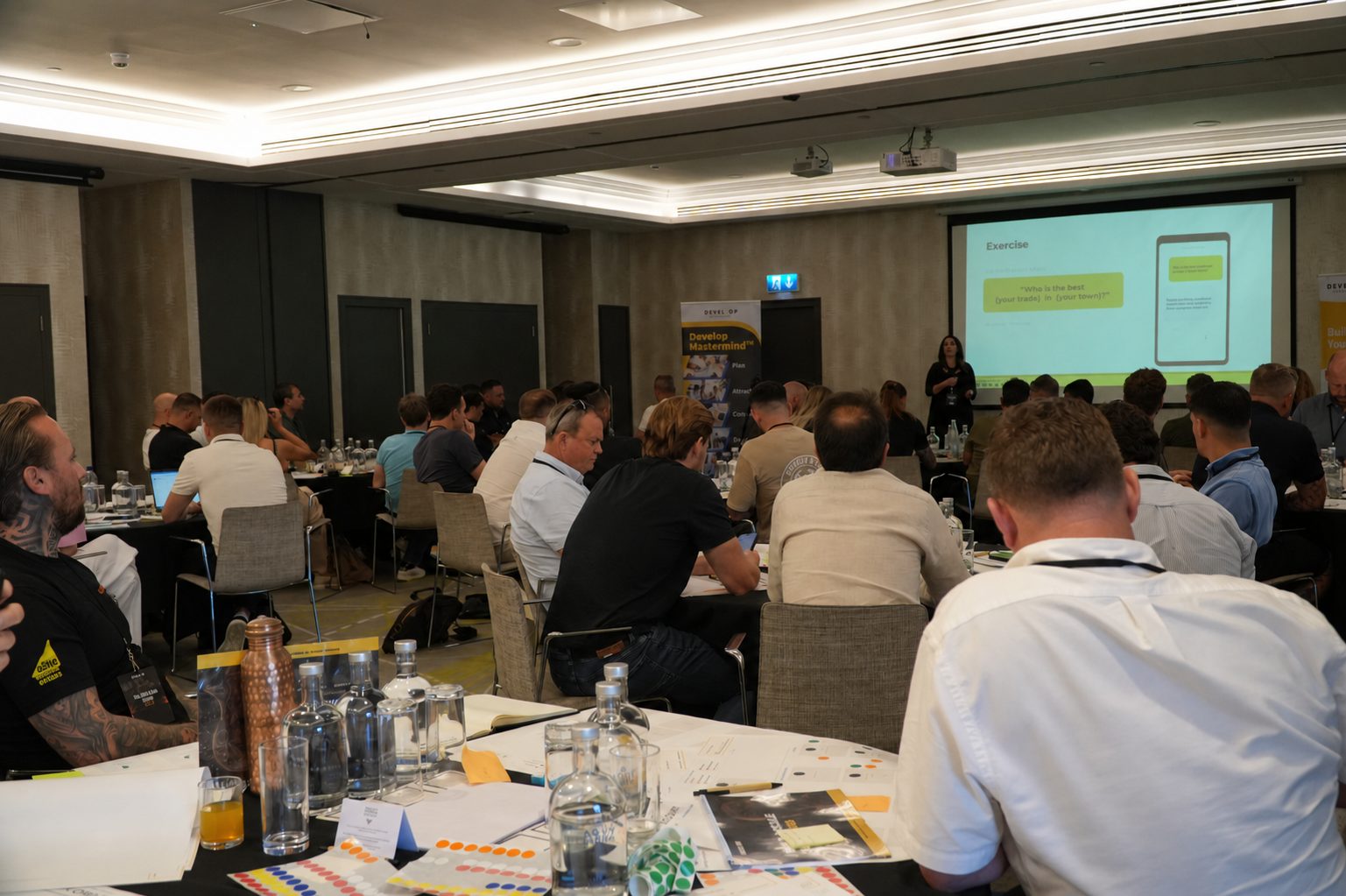Angie Wilkes speaking to a room at an AI workshop